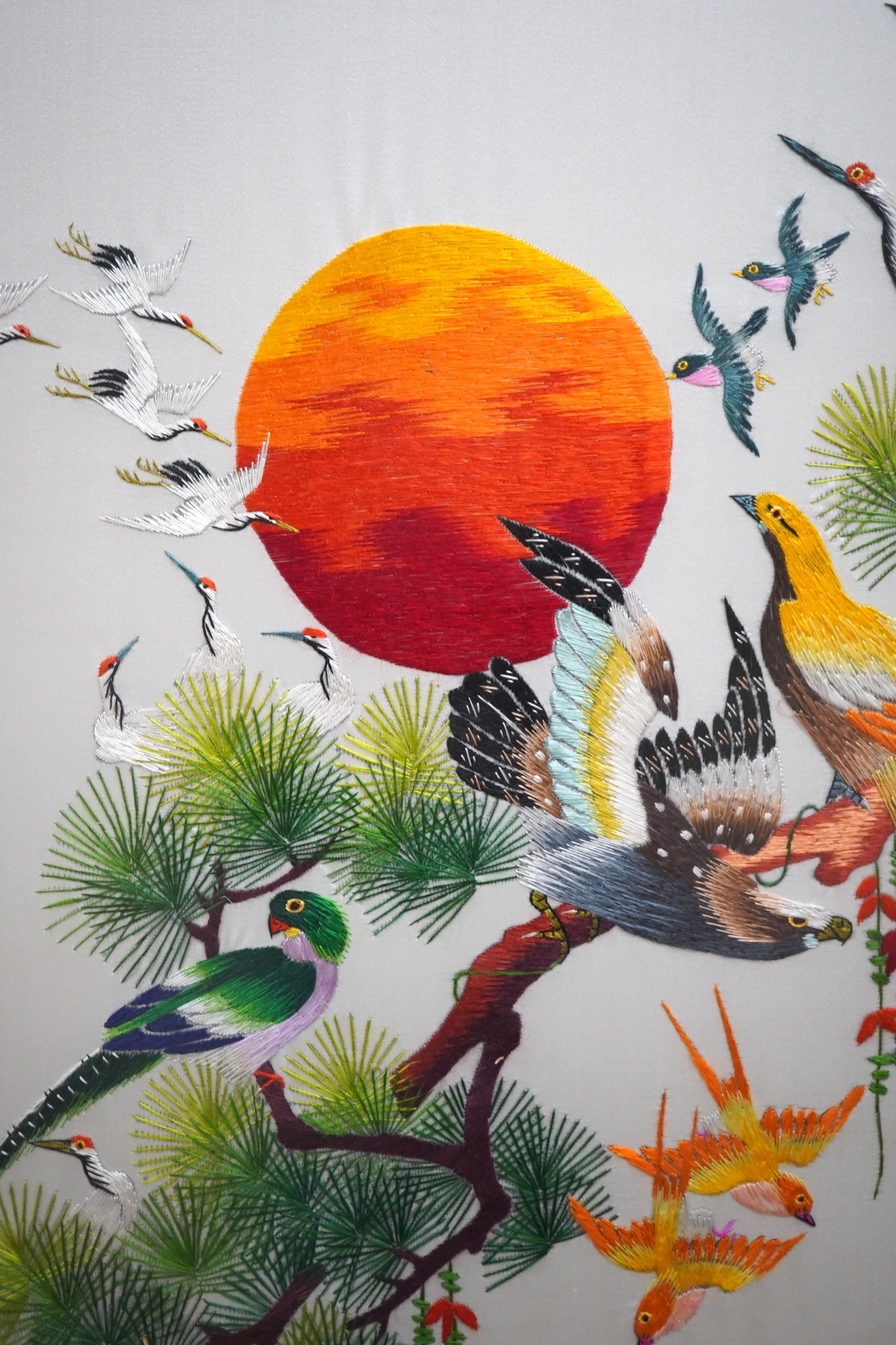 A modern Chinese embroidery on silk depicting birds of paradise, signed with character marks, 120 x 67cm. Condition - good